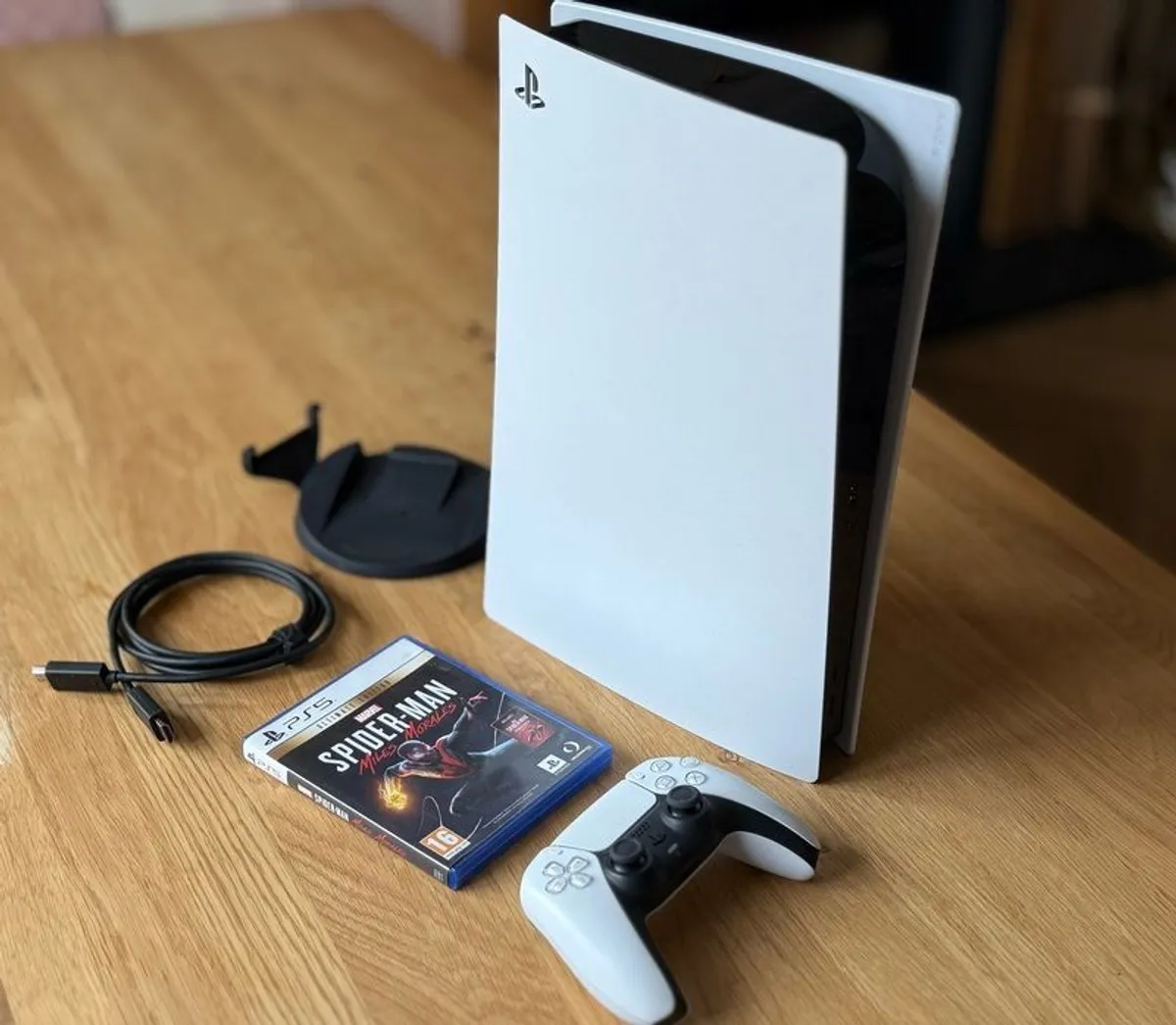 PS5 disc edition with controller, cables and game - Image 1