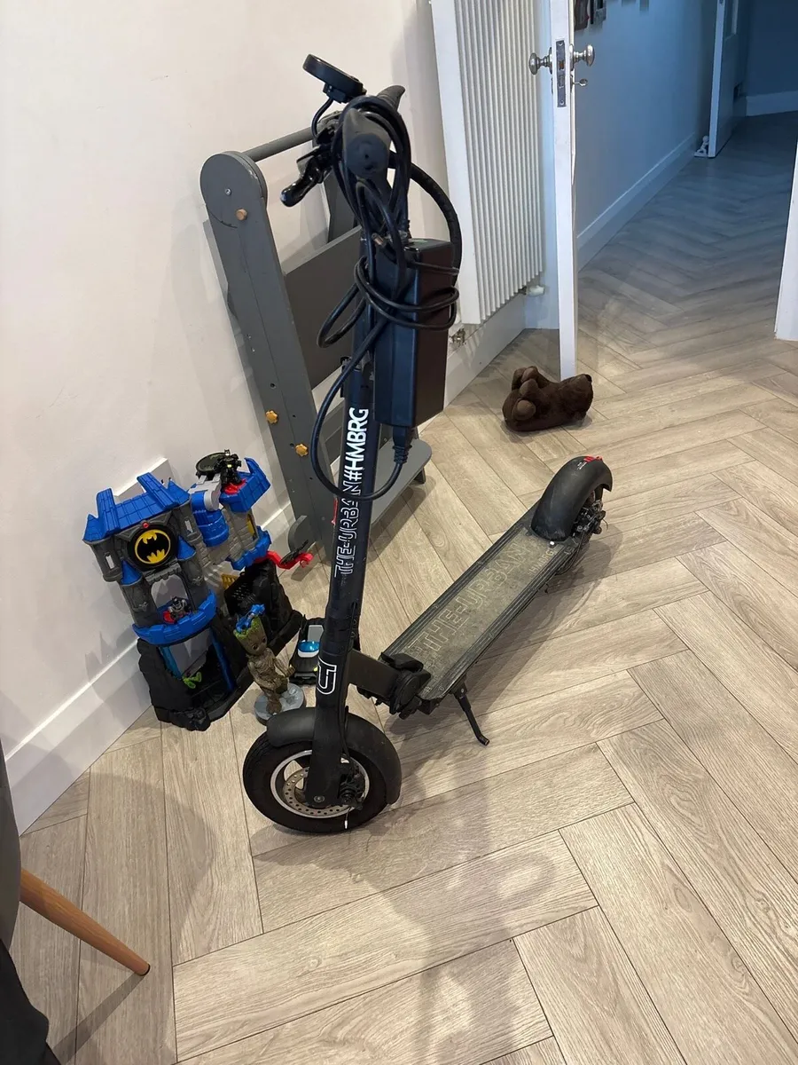 Electric Scooter including charger and New Helmet - Image 2
