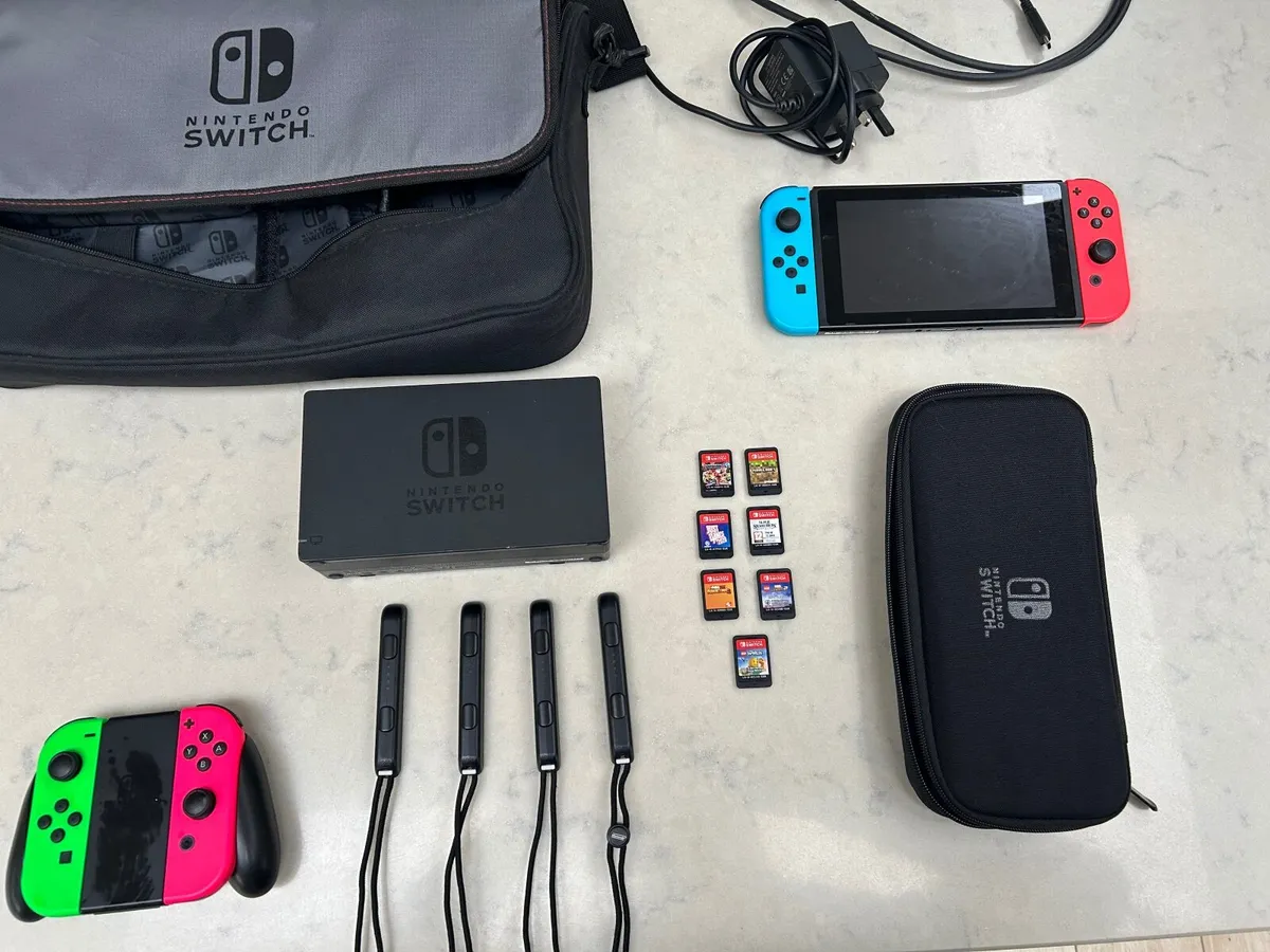 Nintendo Switch, accessories and 7 games.