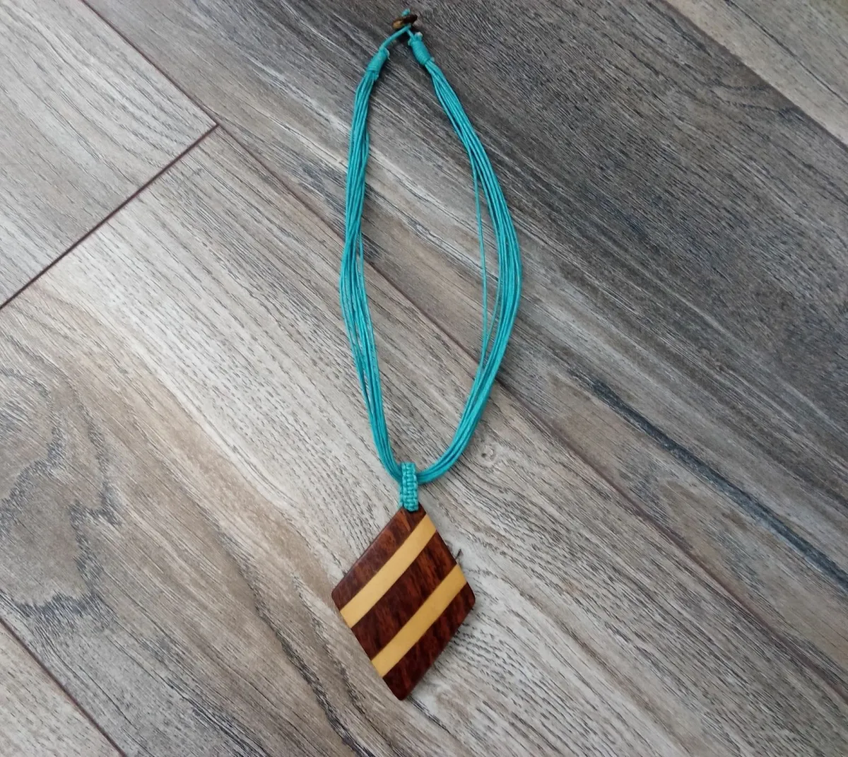Turquoise Stringed Wooden Charm Necklace. - Image 1
