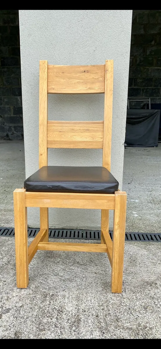 10 Oak dining chairs. Willing to sell separately.