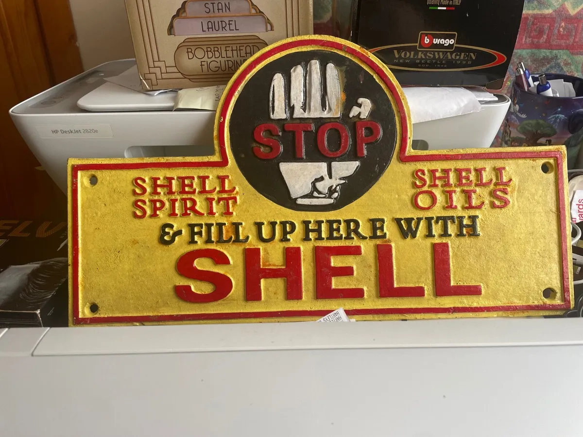 CAST IRON SHELL SIGN