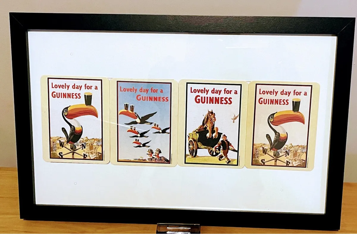 Guinness collectible bar mats in frame