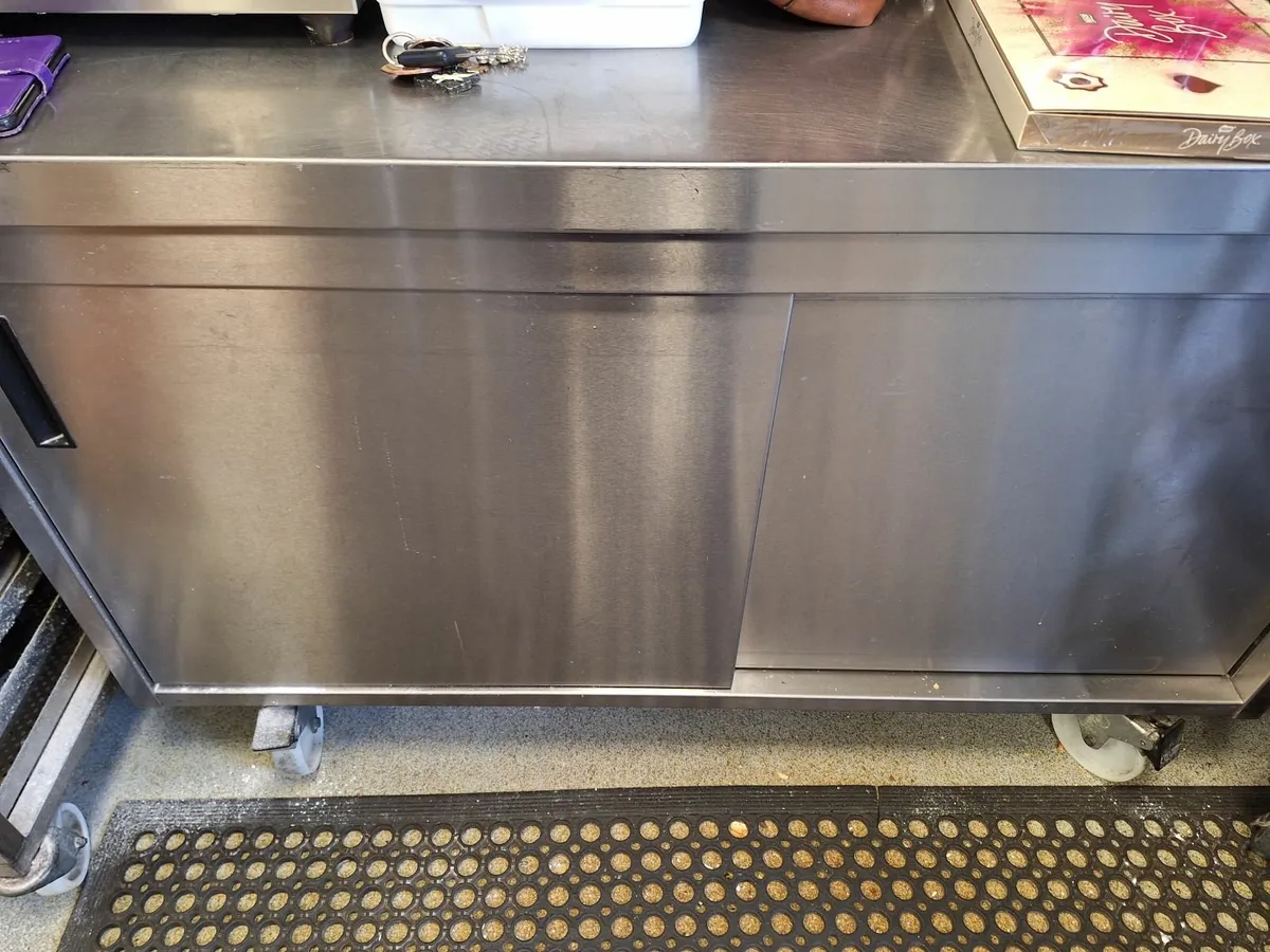 Stainless steel table and storage - Image 1