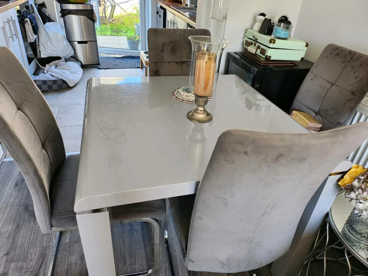 A.Table and chires .the chirs are grey.and sliver - Image 2