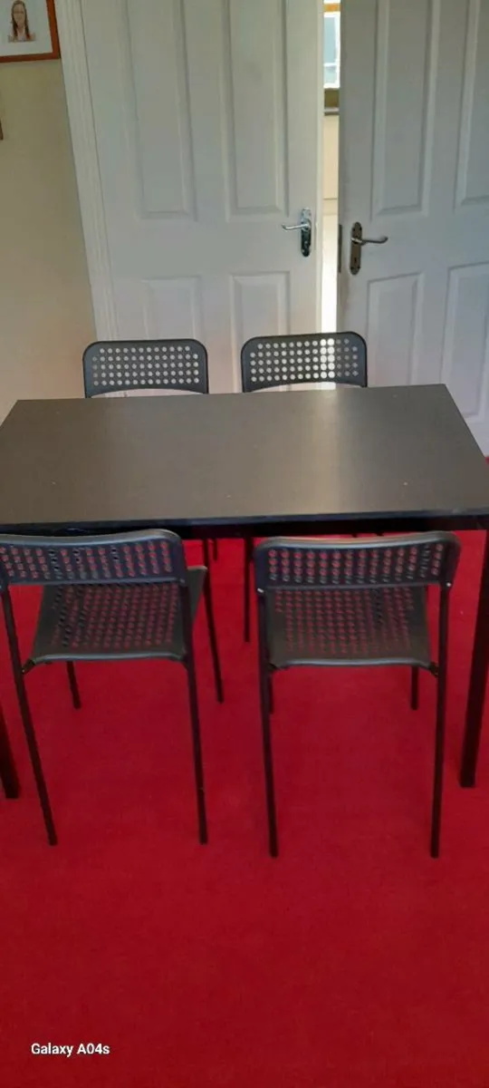 Table and chairs. - Image 1