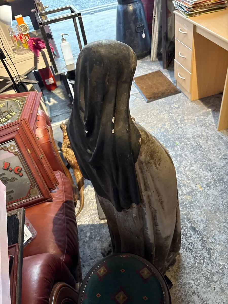 A Weathered blasted statue of saint these Lisieux. - Image 3
