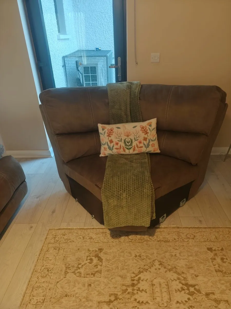 Part of a corner sofa and rug - Image 1