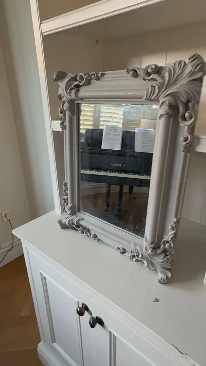 Ornate wooden framed mirror