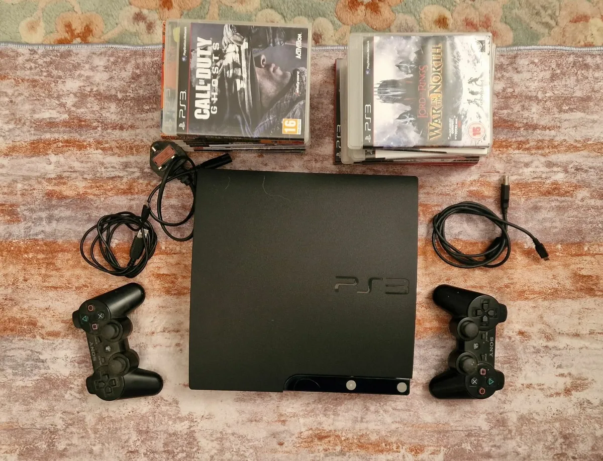 Play Station 3 (ps3) + 2 controllers & 17 games - Image 1
