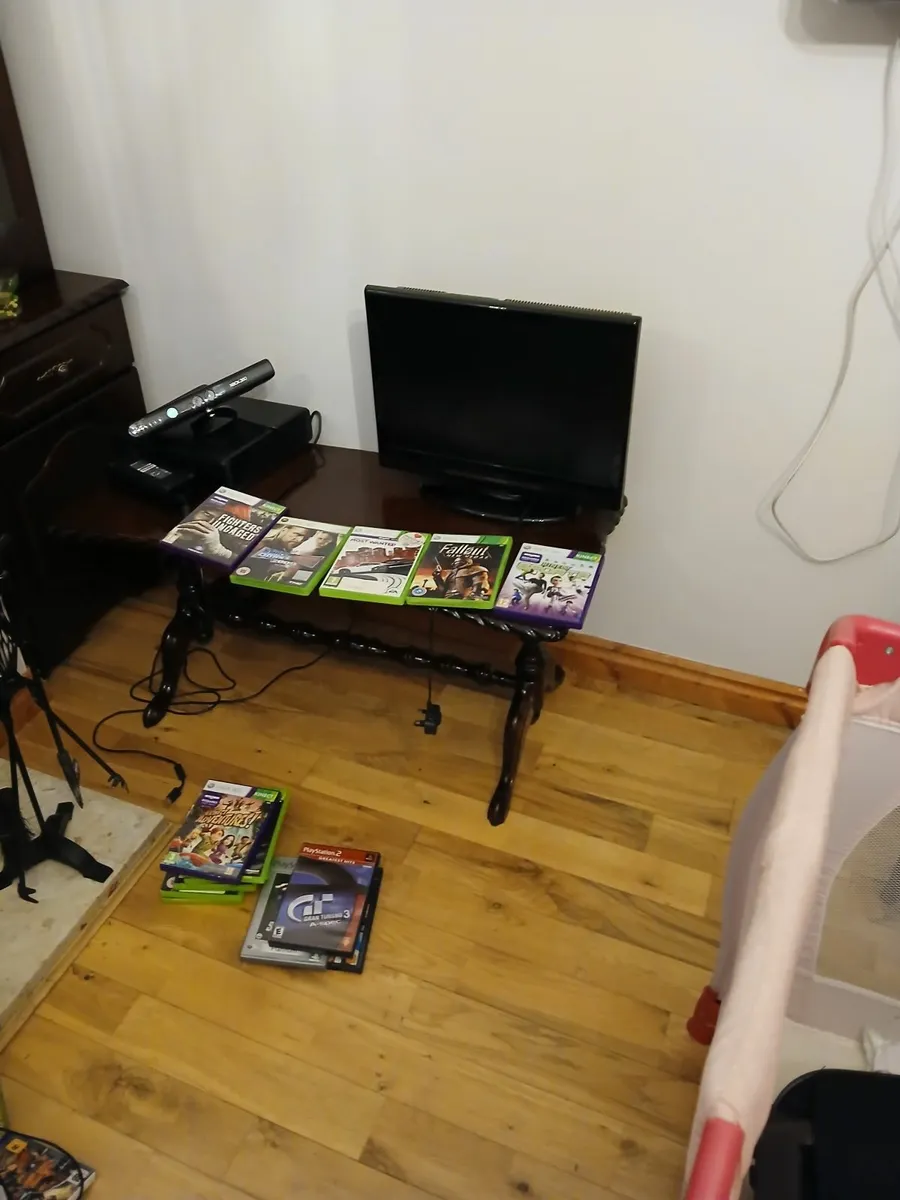 X box with  games  and  small  t.v