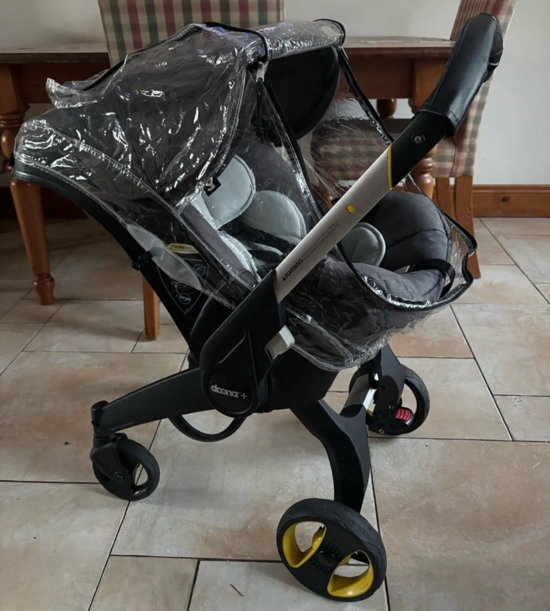 DOONA Carseat Stroller & Raincover Footmuff - Image 1