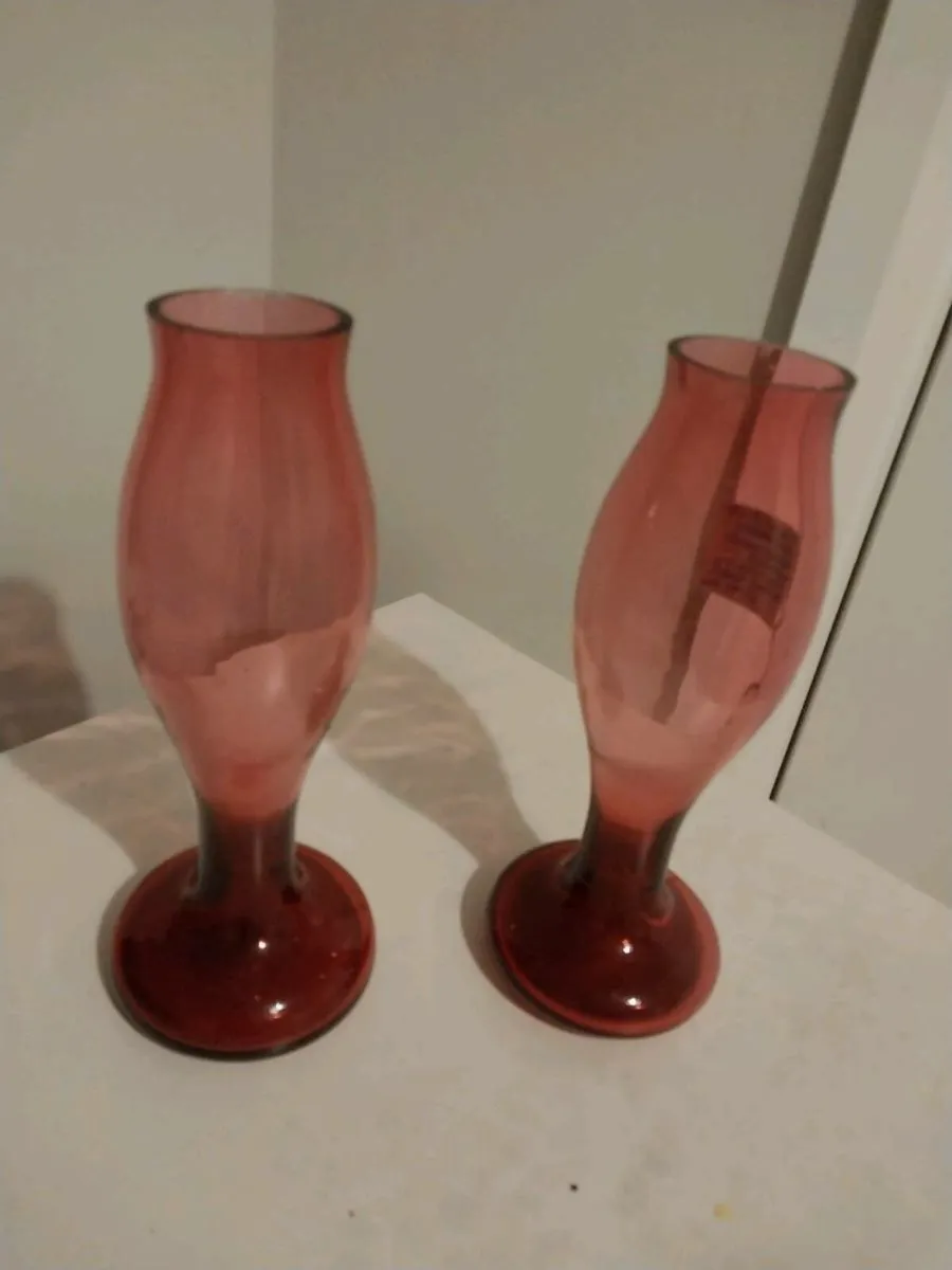 Two matching pink glass vases in great condition.