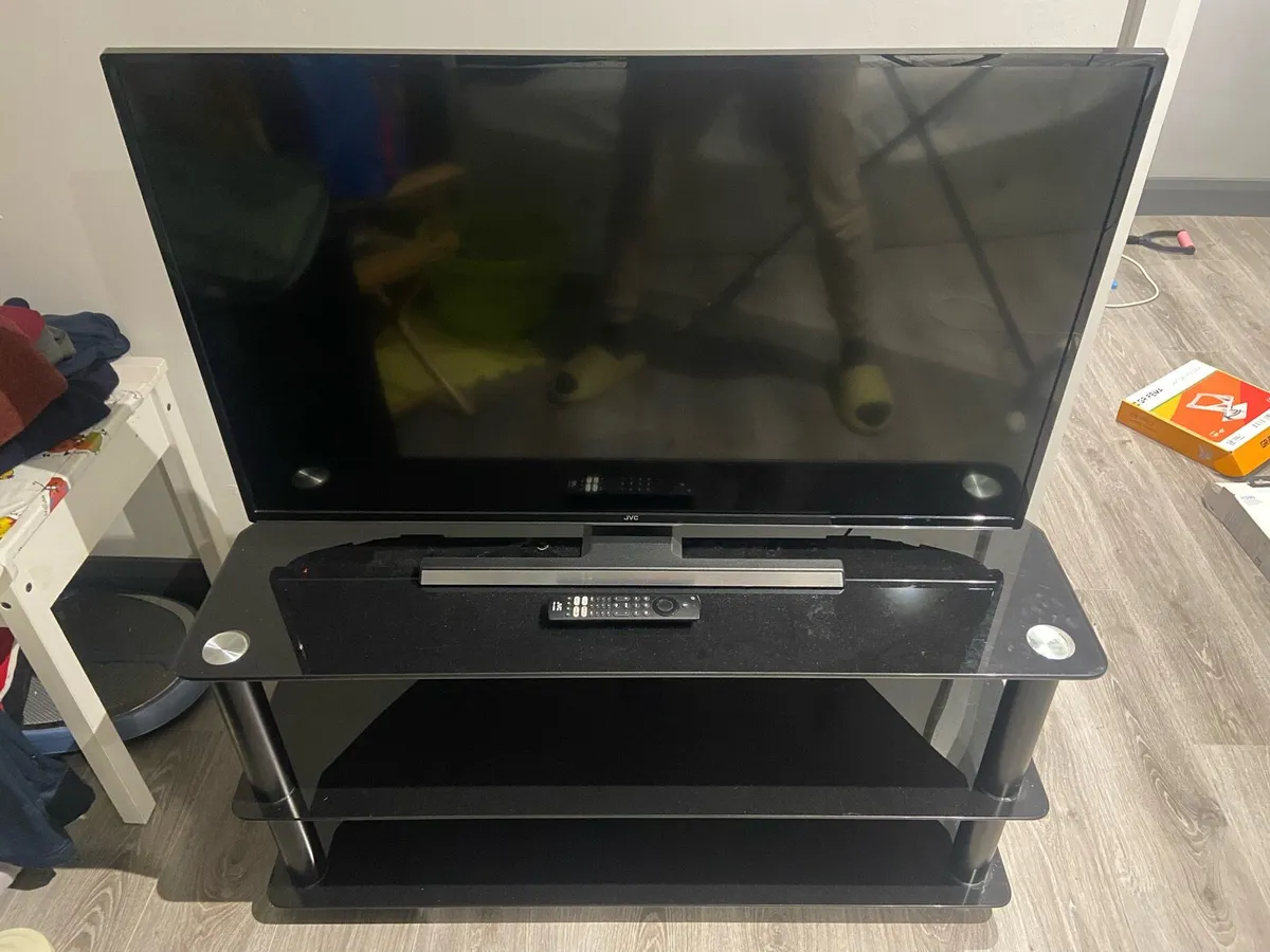 40" JVC 4k smart TV + TV stand - Image 1