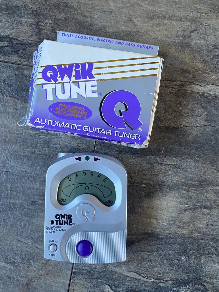 Electric guitar with stand and tuner - Image 4