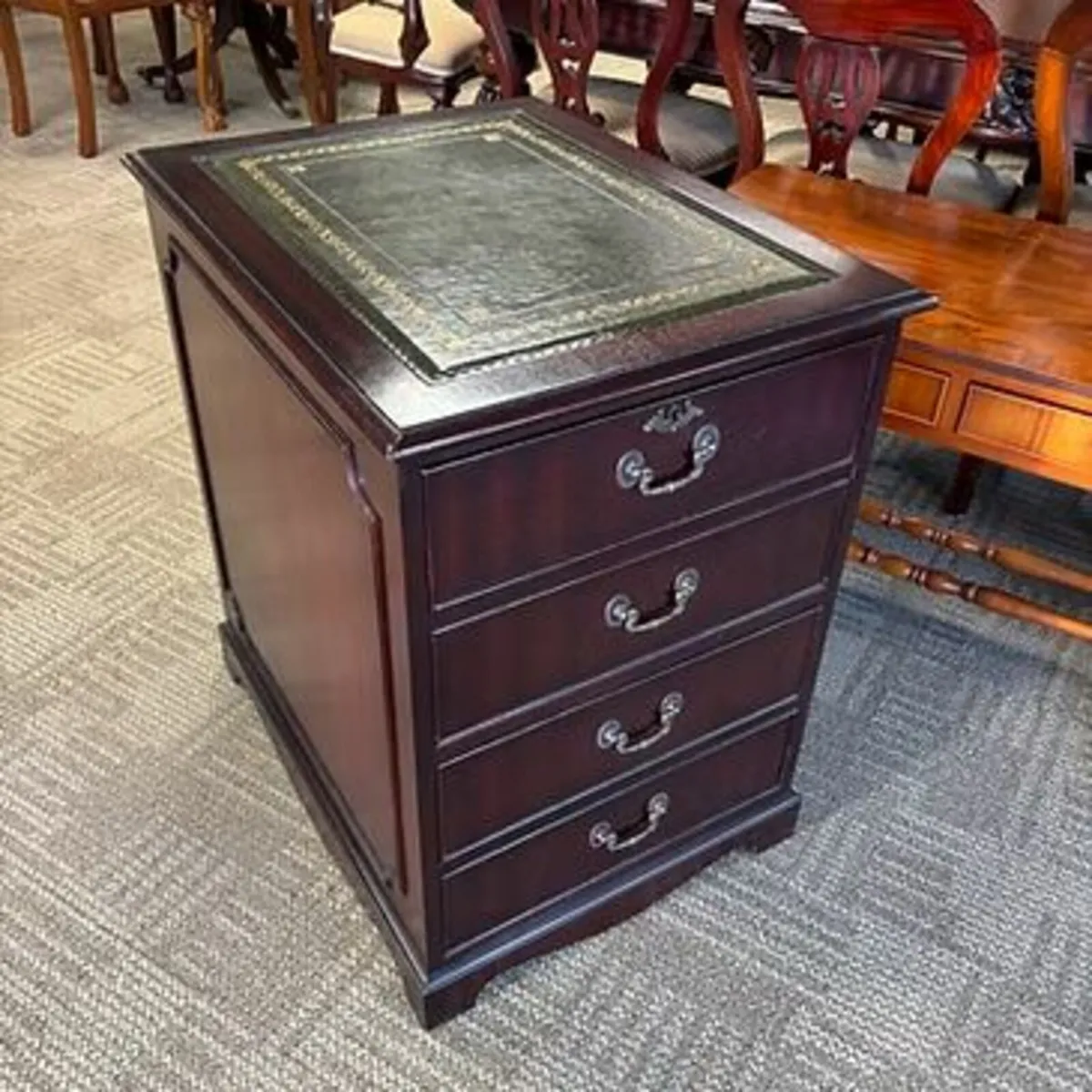Beautiful mahogany green leather top filing cabine