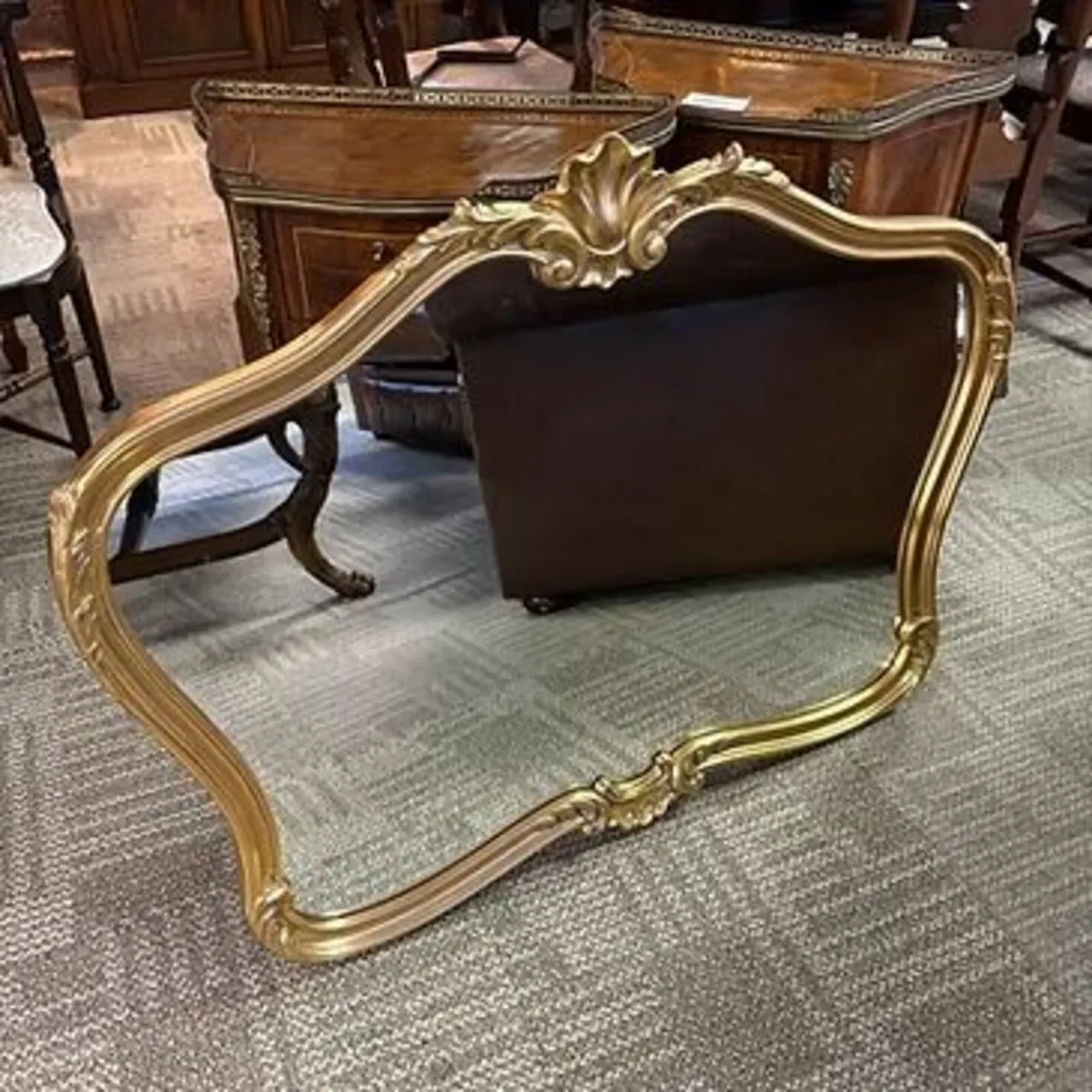 Ornate gilt framed over mantel mirror