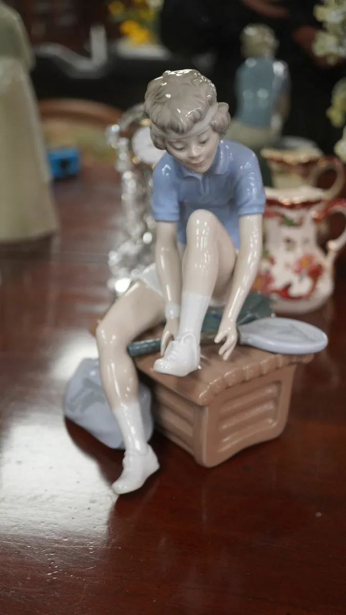 Nao by Lladró “Tying His Shoe” Porcelain Figurine - Image 1