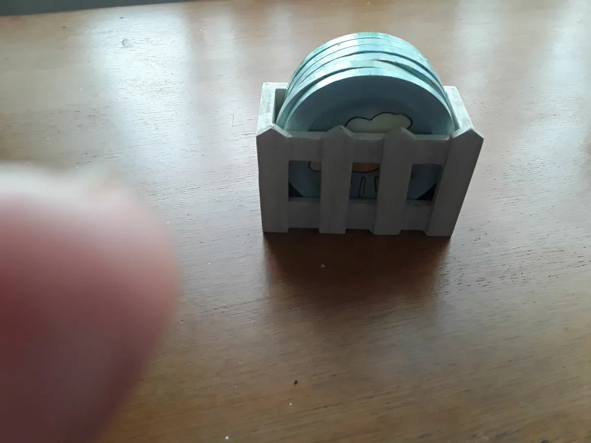 Small ceramic tea coasters in container - Image 2