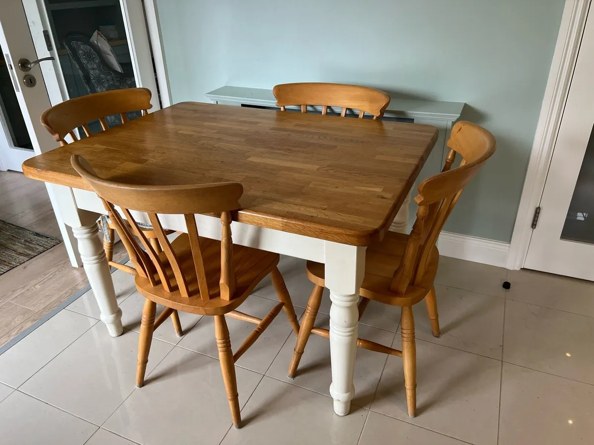 Solid oak farmhouse table and four chairs - Image 1