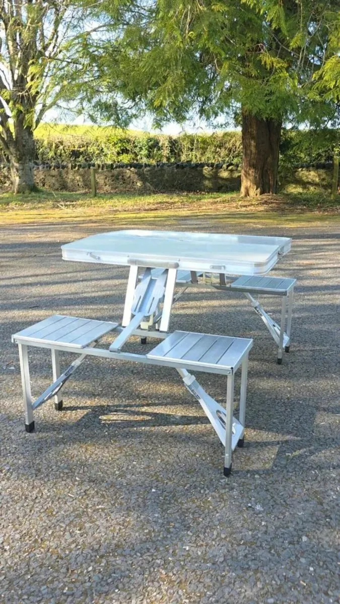 Foldable camping table with four seats. - Image 1