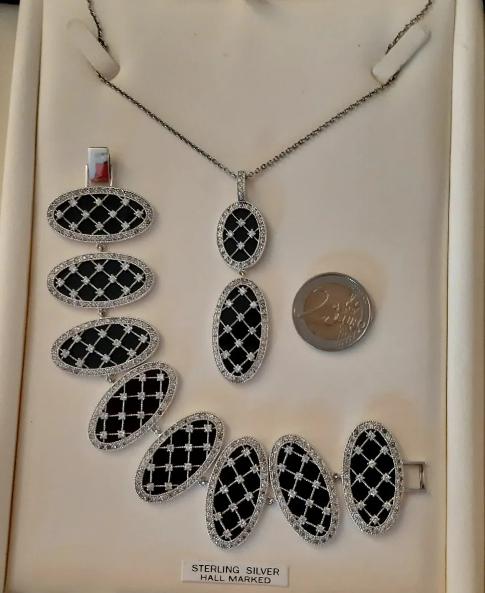 Silver and Black Pendant and Bracelet - Image 1