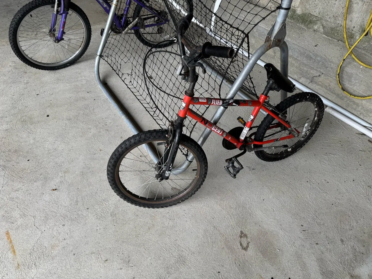 Two kids bikes 12” frame and 14” and rebounder net - Image 2