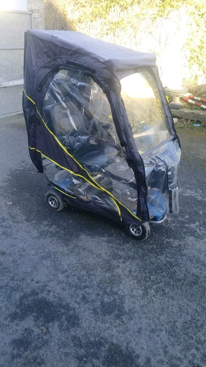 Rascal electric scooter with waterproof cover - Image 1