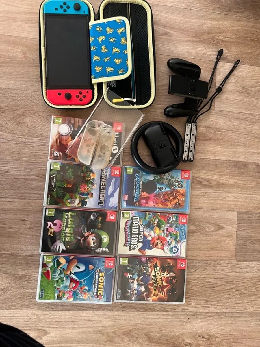 Nintendo Switch Oled with Games and all Accessories - Image 1