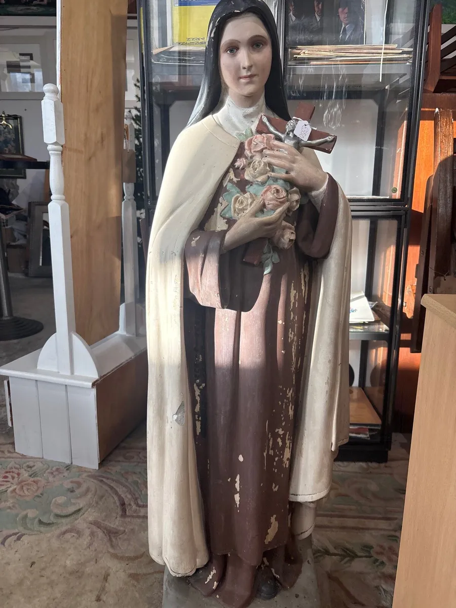 A Weathered blasted statue of saint these Lisieux. - Image 4