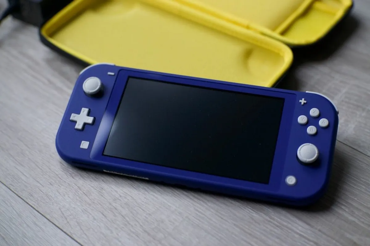 Nintendo Switch Lite & Case with Charger - Image 1