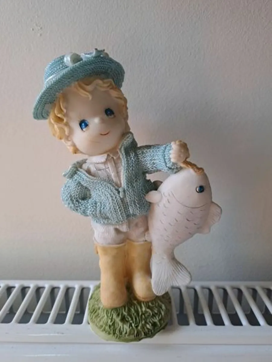 Vintage bisque boy holding a fish - Image 1