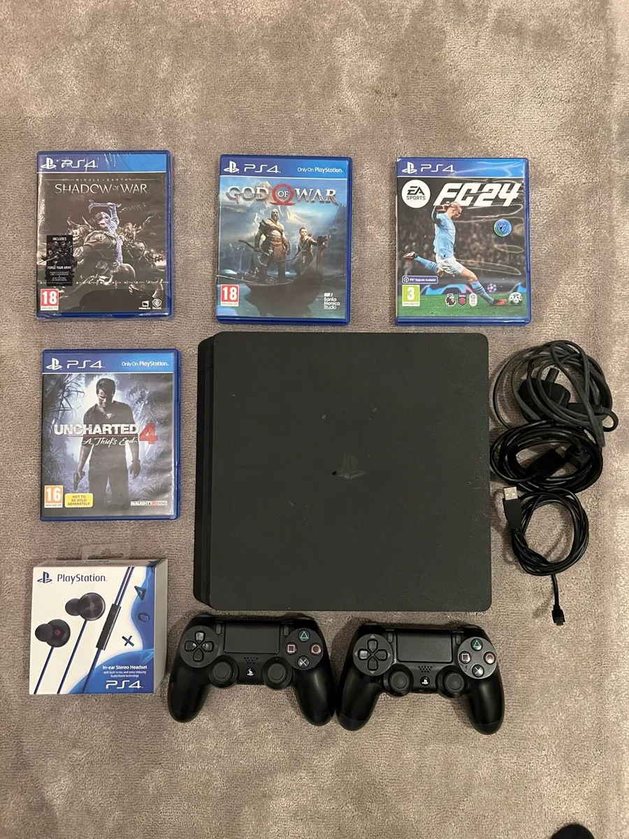 PS4 1TB slim with 2 controllers & 4 games