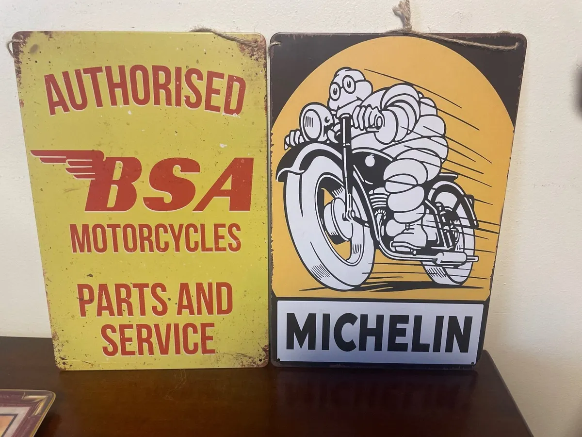 TWO MOTOR CYCLE  SIGNS