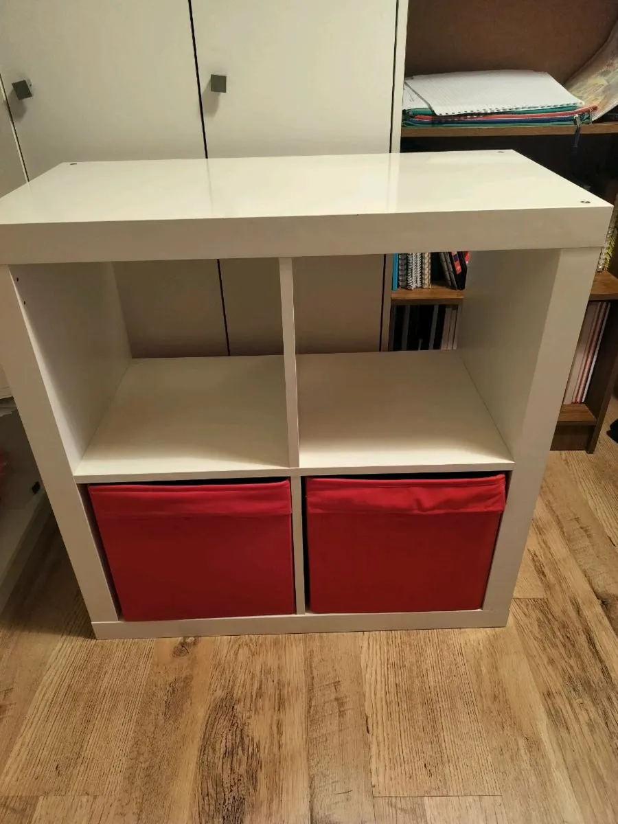 Bookcase Kallax white with 2 red storage boxes