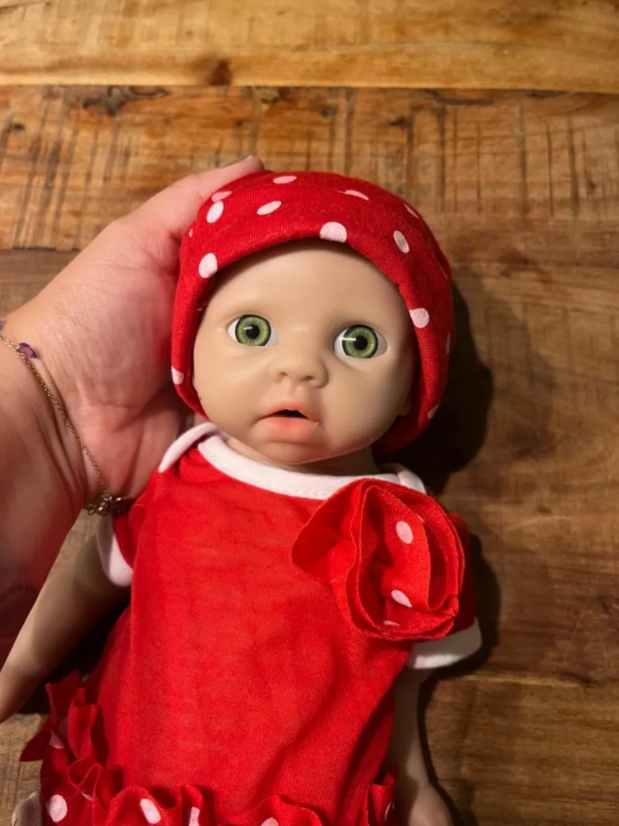 Full body silicone reborn baby doll in red outfit - Image 2