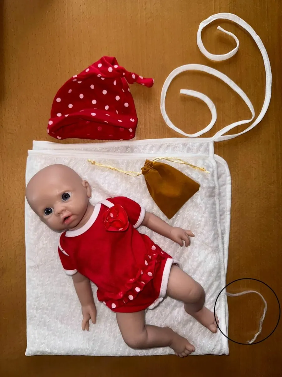 Full body silicone reborn baby doll in red outfit - Image 3