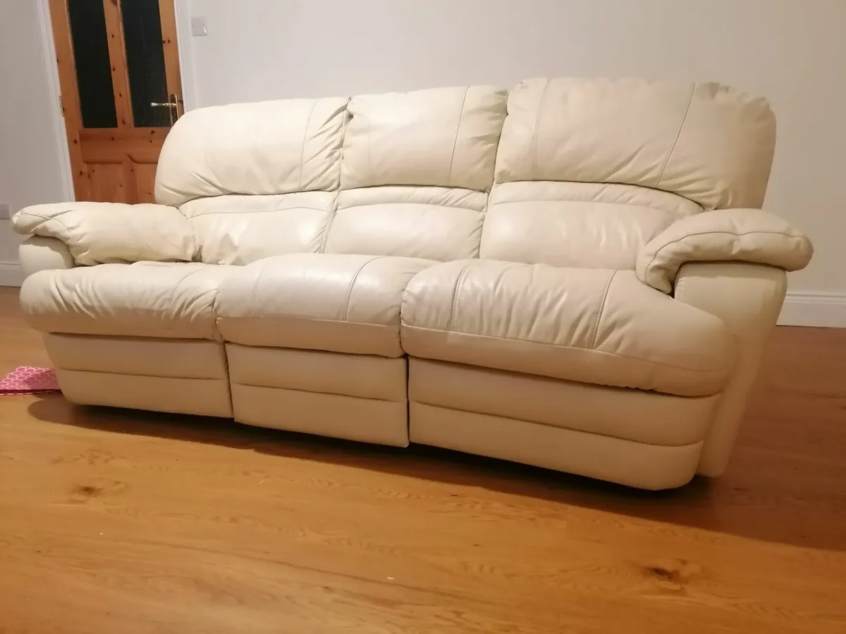 Real leather three seater and a two seater couches - Image 1