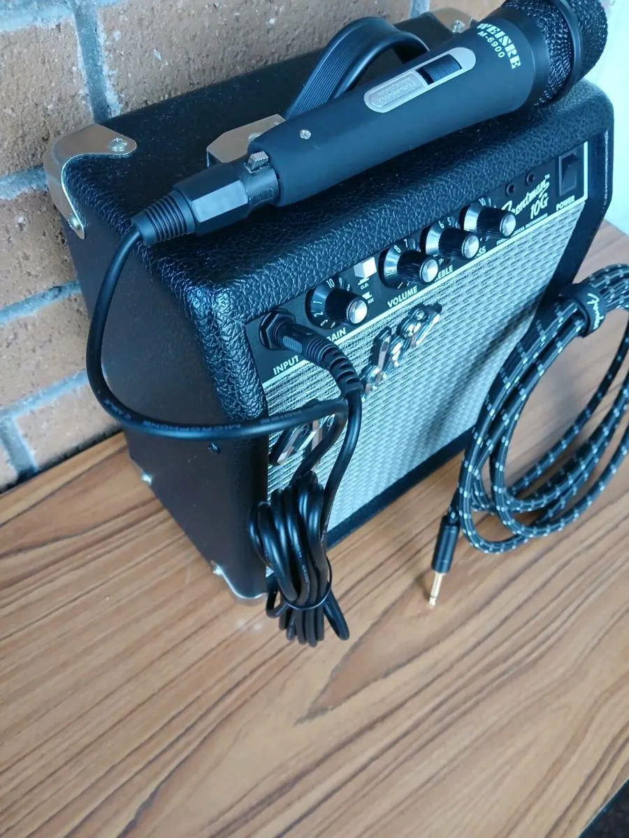 New Fender amplifier + microphone + guitar lead. - Image 1