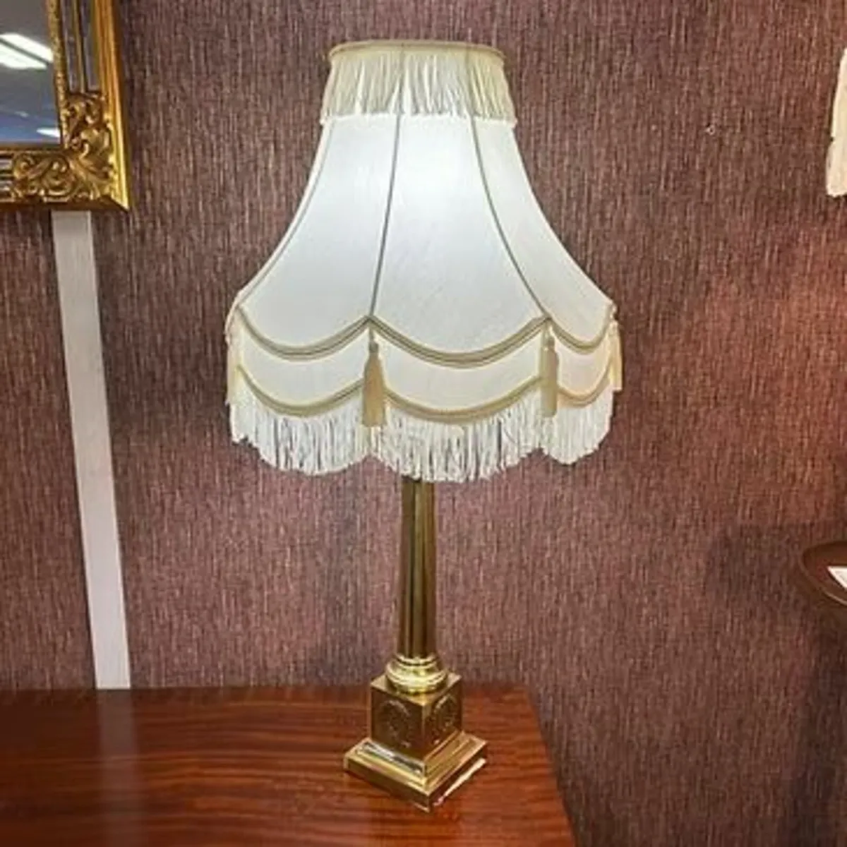 Gorgeous brass pillared shaped white shaded table