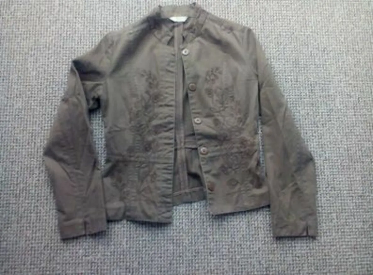Women's Jacket with Embroidery Style Detail.