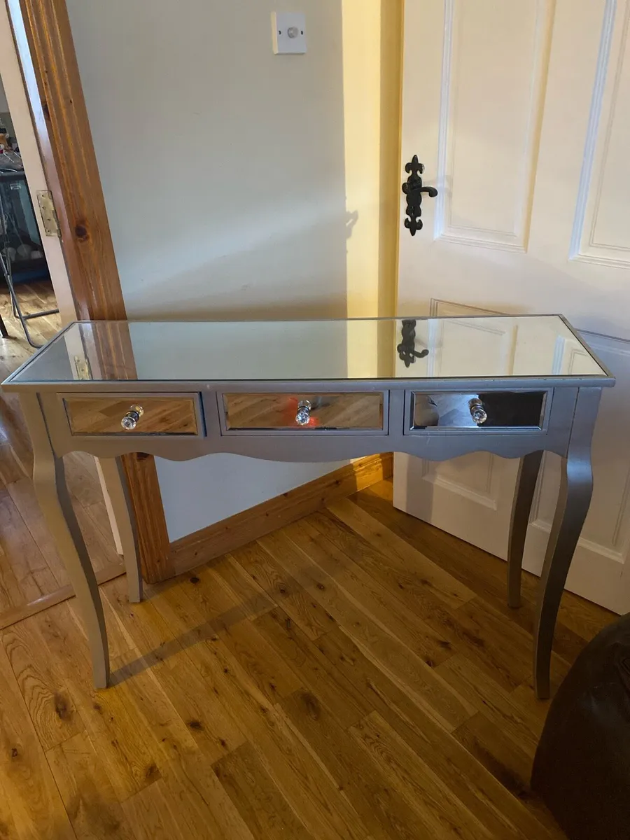 Mirrored 3 drawer table with silver surround