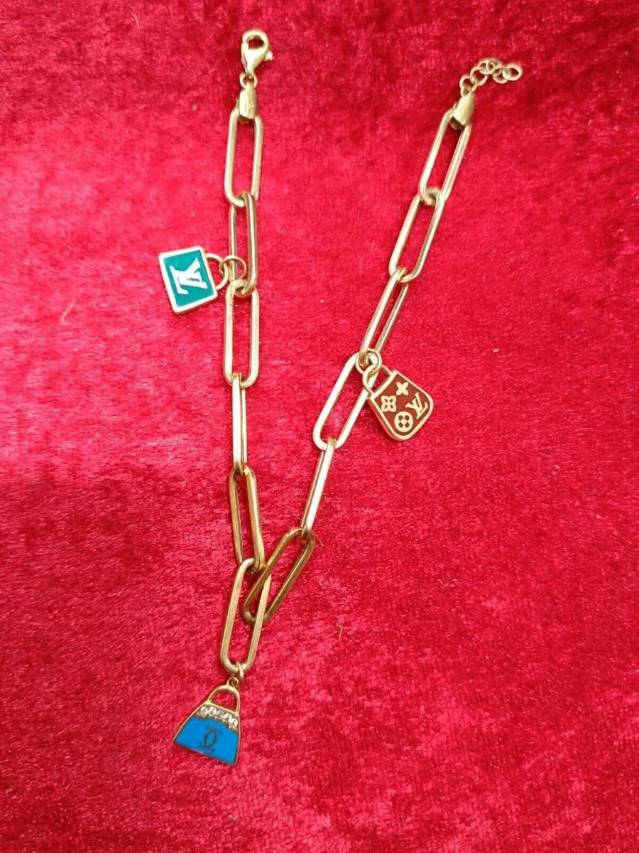 18k Yellow Gold Paperclip Bracelet With LV Charms - Image 1