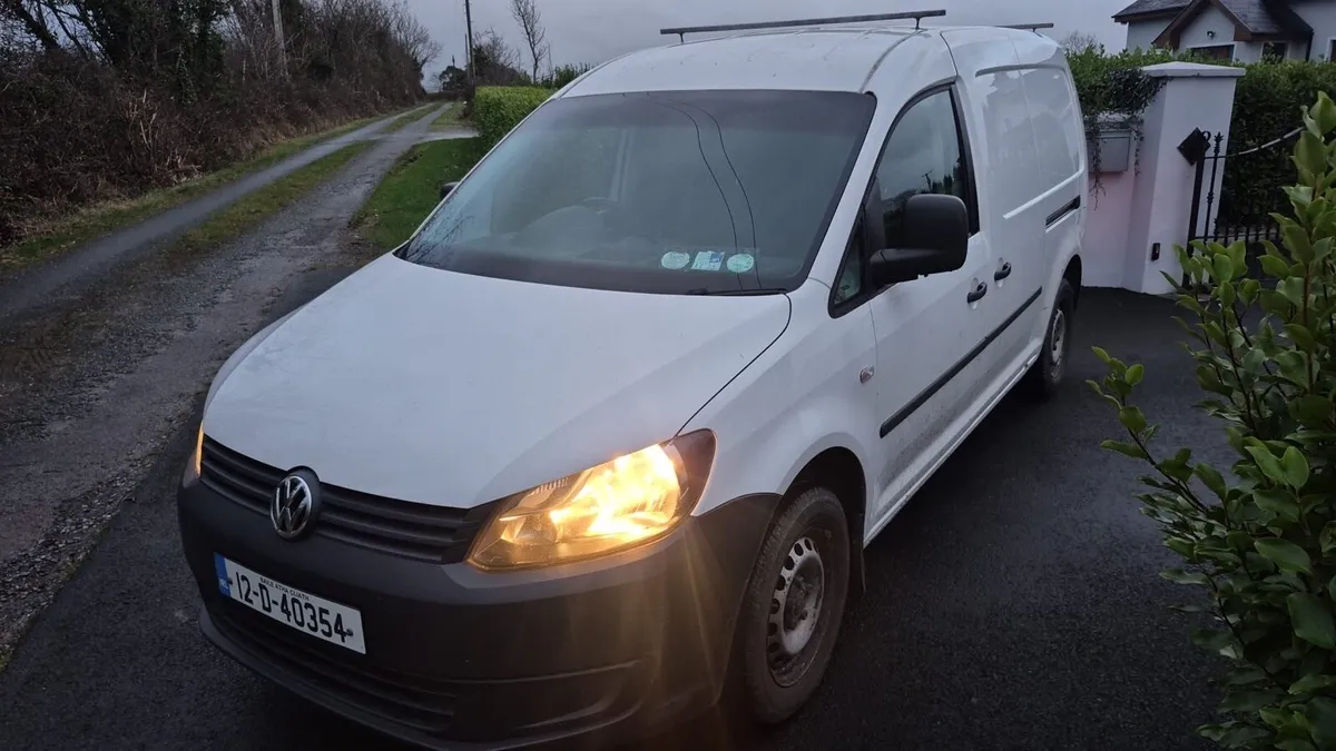 White Caddy Van - Image 1