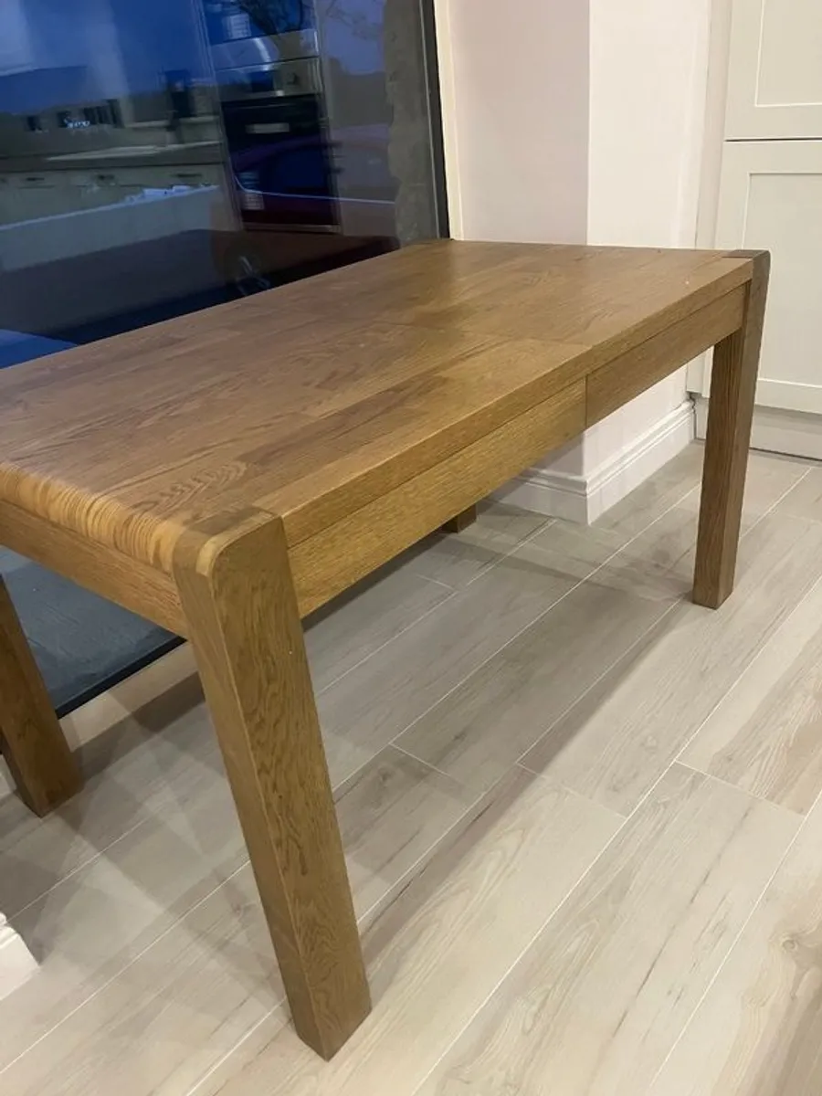 Oak extendable dining table and bench - Image 1