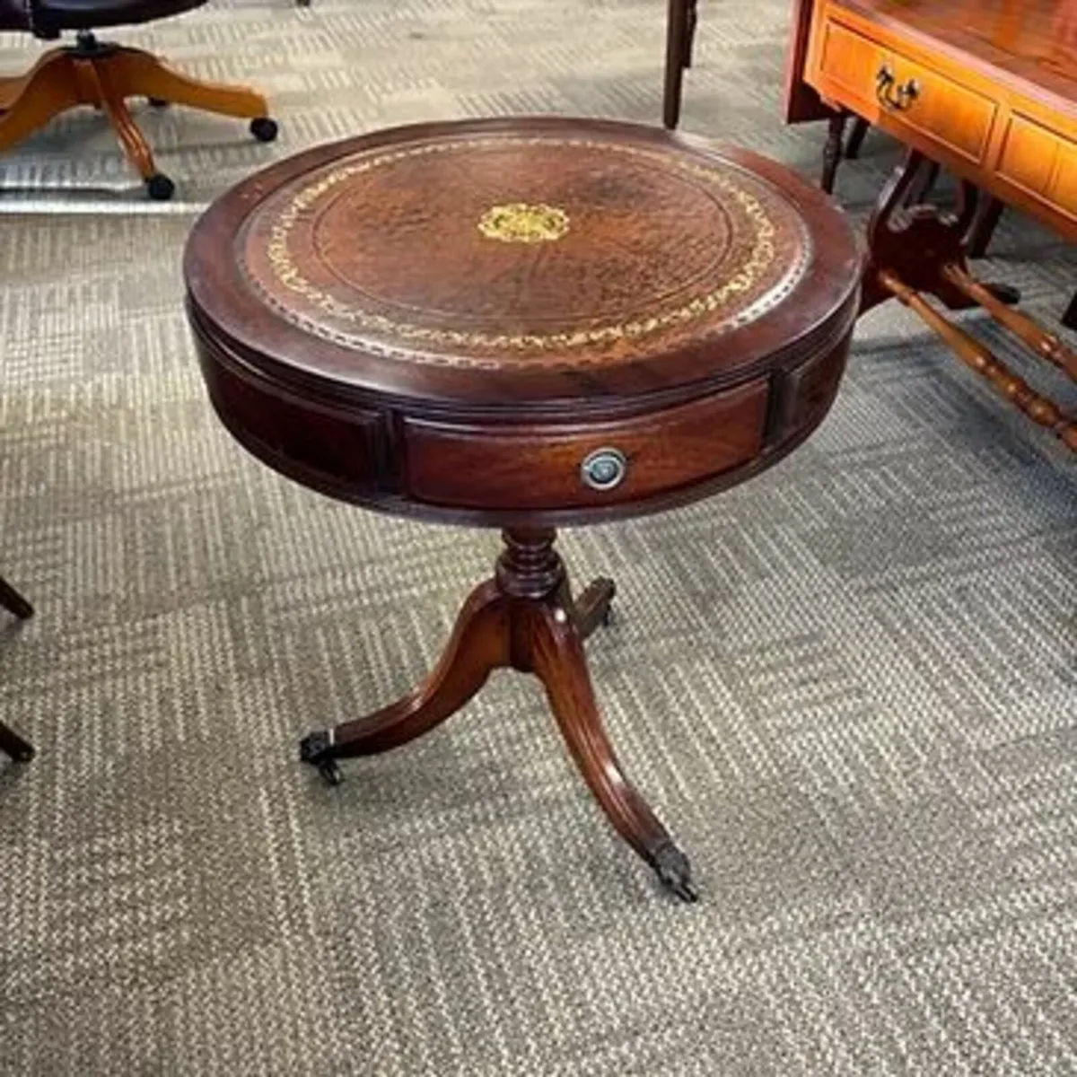 Beautiful mahogany brown leather top drum table. S