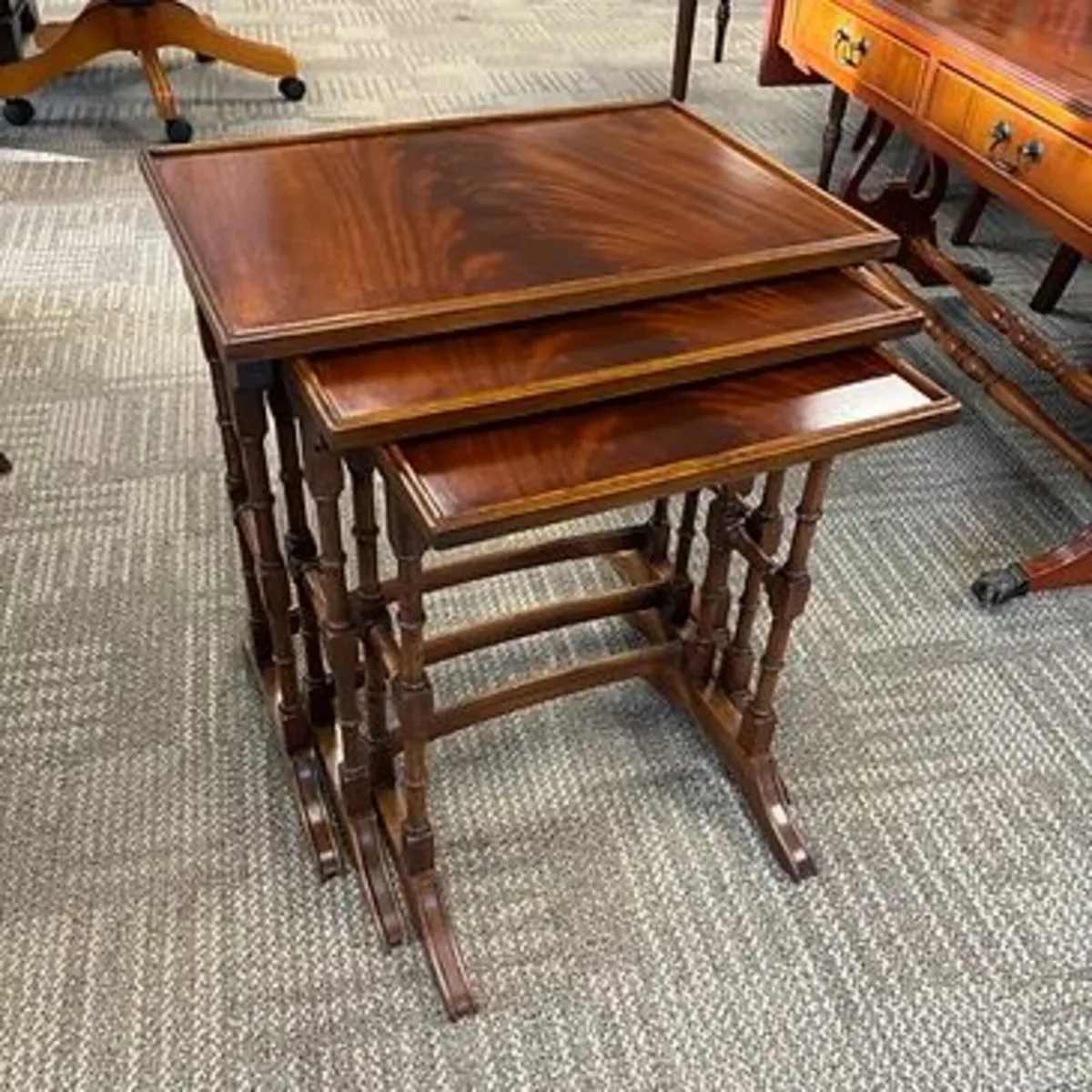 Fabulous mahogany flamed nest of three tables