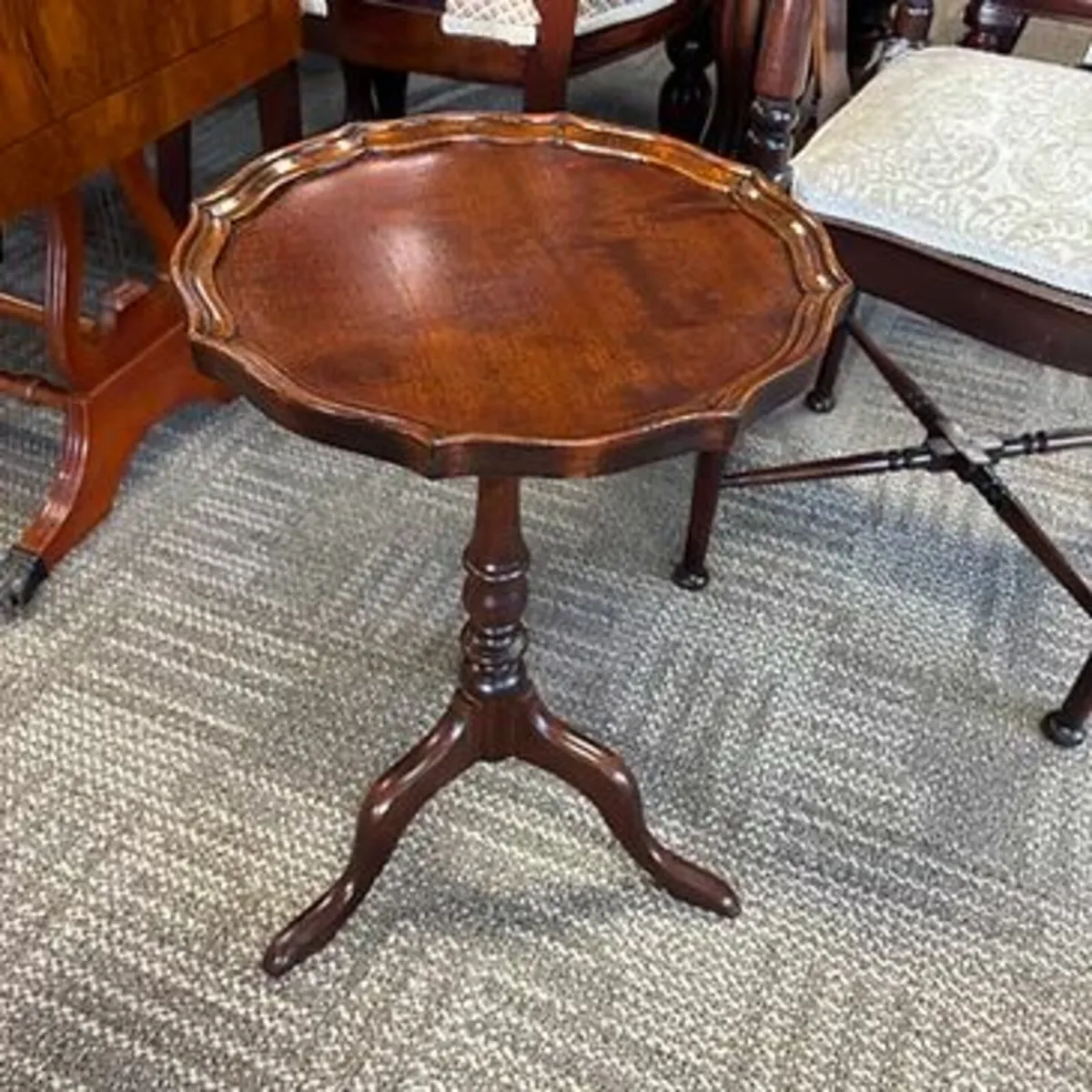 Beautiful mahogany shaped edge round tripod base w