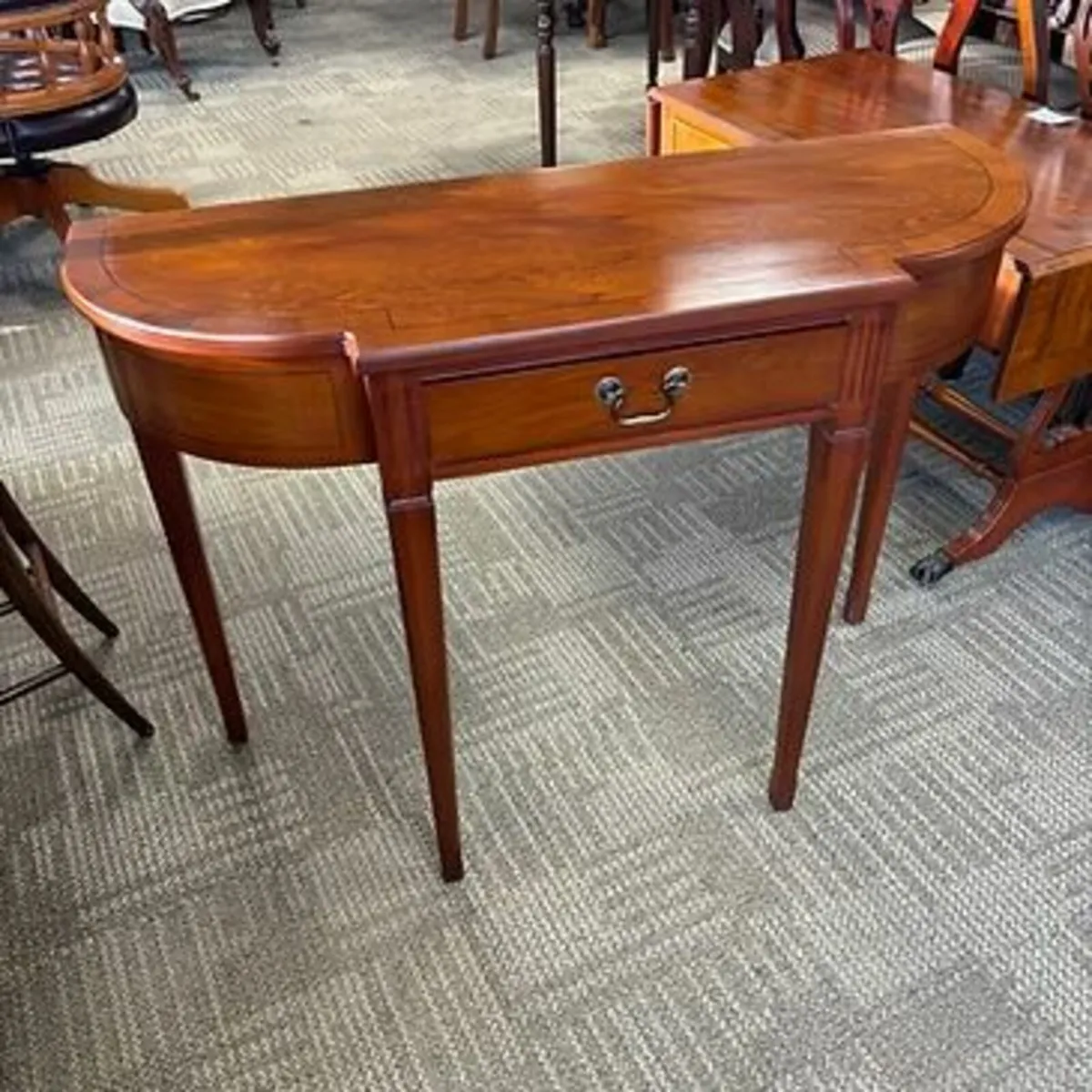 Fabulous yew breakfront console table. Drawer to t