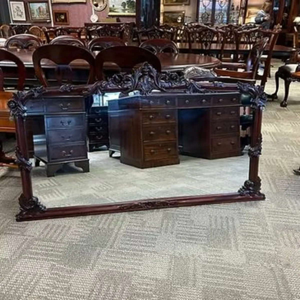 Fabulous mahogany floral shaped wall mirror. Swipe